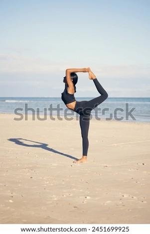 Woman, yoga and stretching on beach with fitness for exercise, training or outdoor workout in nature. Female person or yogi in body warm up or pilates for balance, health and wellness by ocean coast