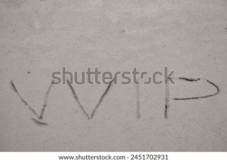 photo of vvip writing on mud after the flood recedes in the river