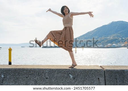 A woman having fun at the seaside