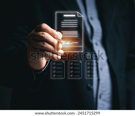 Businessman signs documents to approve work online using mobile virtual screen. Electronic signature and paperless office concept. E-signing. Technology and document management. Working online.
