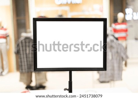 Empty sign inside shopping mall. mock up advertise display frame setting over the shopping department store for shopping. copy space.