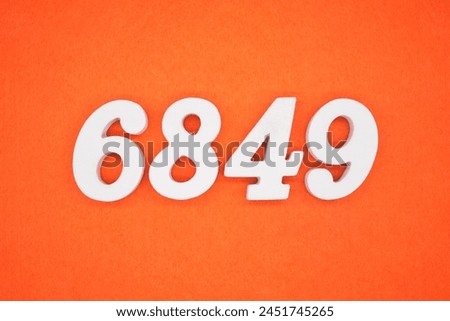 Orange felt is the background. The numbers 6849 are made from white painted wood.