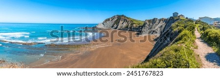 Panoramic of the Itzurun beach without people in the Flysch Basque Coast geopark in Zumaia, Gipuzkoa