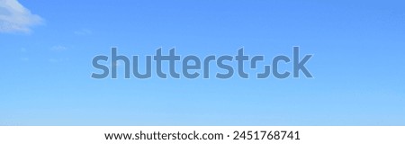 Panoramic photo of blue clear sky. Design of backgrounds, screensavers, cards, covers.