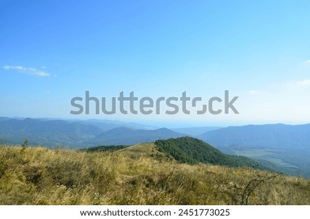 Beautiful mountain landscape. Caucasus Mountains. Panoramic photo. Design for background, cover, screensaver, postcard, calendar.