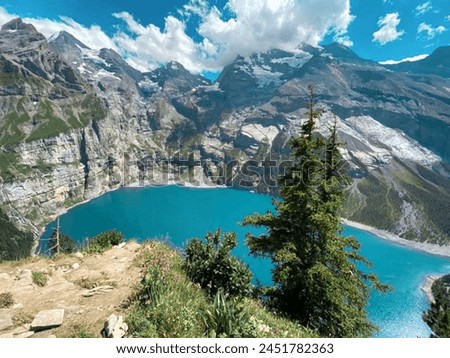 The stunning beauty of Oeschinen Lake in Switzerland, a must see and bucket list moment  Royalty-Free Stock Photo #2451782363