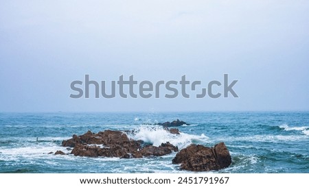 Huangdao District, Qingdao City, Shandong Province-Sprays on the Golden Beach Royalty-Free Stock Photo #2451791967