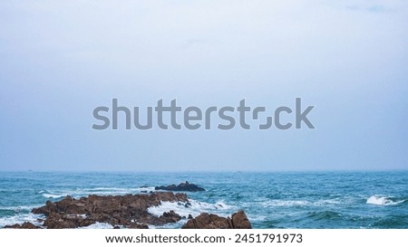 Huangdao District, Qingdao City, Shandong Province-Sprays on the Golden Beach Royalty-Free Stock Photo #2451791973