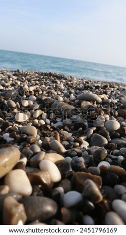 dark round sea stones-close-up dark round sea stones--stones on the beach-background image for quotes-background for phone-sea stone background for phone-