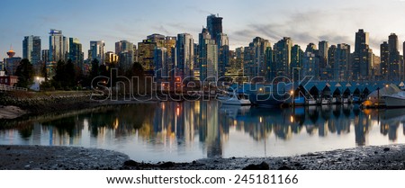 Vancouver Skyline. The beautiful Vancouver skyline taken from Stanley Park during sunset. The city marina can be seen in the foreground.