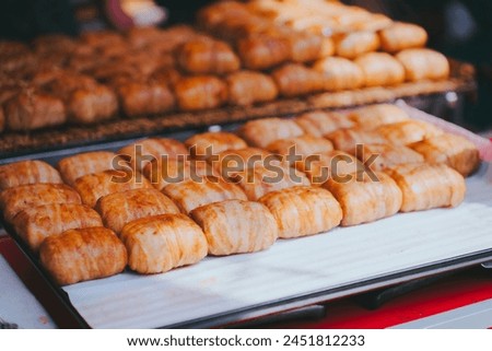 A tray of bite-sized pieces of bacon wrapped goodness. Royalty-Free Stock Photo #2451812233