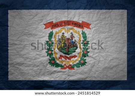 colorful big national flag of west virginia state on a grunge old paper texture background