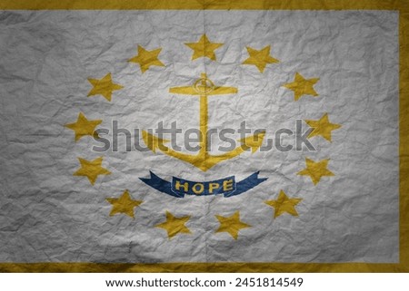 colorful big national flag of rhode island state on a grunge old paper texture background