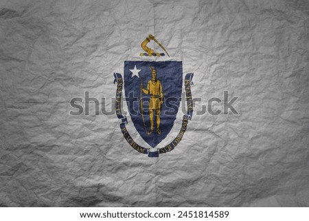 colorful big national flag of massachusetts state on a grunge old paper texture background