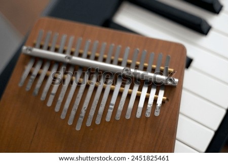 Close-up of a kalimba musical instrument made of brown wood