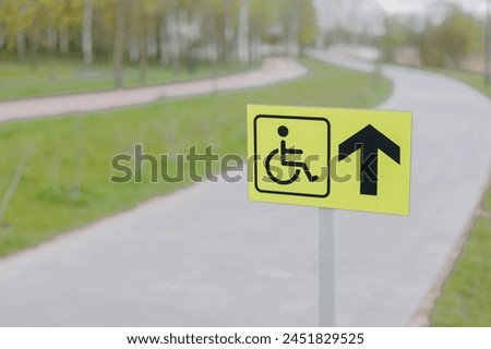 Accessible disabled sign at city park. Inclusivity and equal rights.