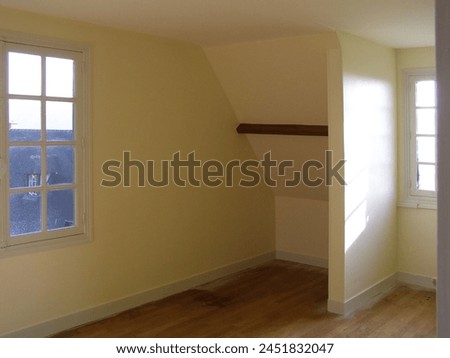 Interior photo view of an empty flat room in a old style house in Normandy in France, Europe. It can be for rent or for sale spacious property room real estate