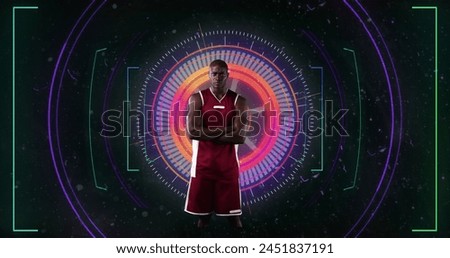 Image of african american sportsman with arms crossed over scope scanning on black background. sport, connections and digital interface concept digitally generated image.