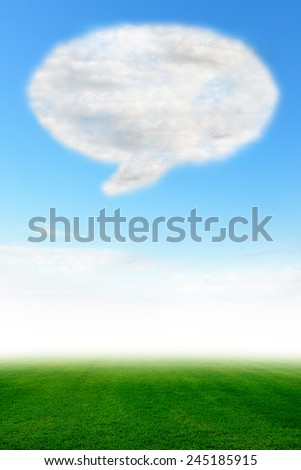 Speech bubble cloud design on blue sky and green field, Picture of vertical for design work