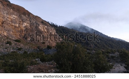 sunrise in mountain with a smoke
