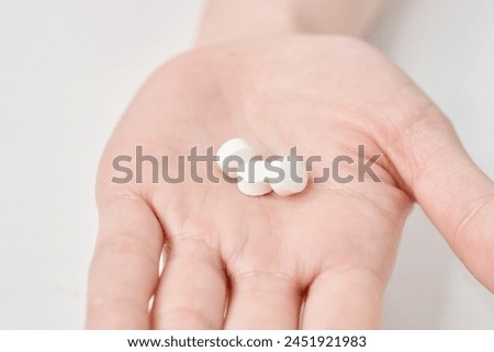 Various pills on the hand