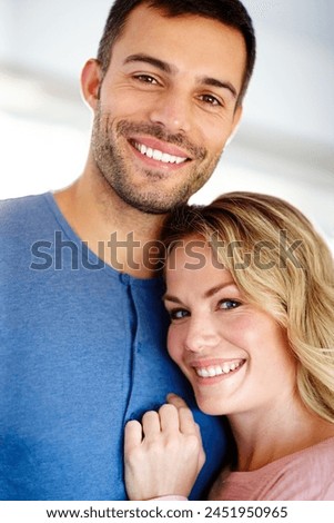 Couple, happy and hug in portrait for love, relationship or memories together. Man, woman and romantic embrace smile for dating, compassion or care in home cheerful for support, commitment and trust