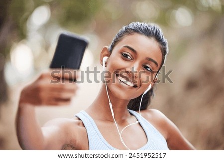 Fitness, selfie and happy woman in park for training, profile picture or running photography in nature. Sports, smartphone and health influencer in forest for live streaming, blog or content creation