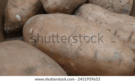 Closeup of sweet potatoes in box, high resolution photography, super realistic photo