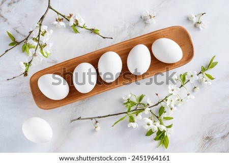 Concept of spring, eggs with flowers, top view. These Are easter themed images. High quality photo