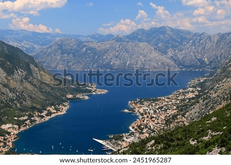 high mountains in Montenegro. Beautiful Kotor Bay and old city Kotor in summer. Full top view boka kotorska, Montenegro Royalty-Free Stock Photo #2451965287