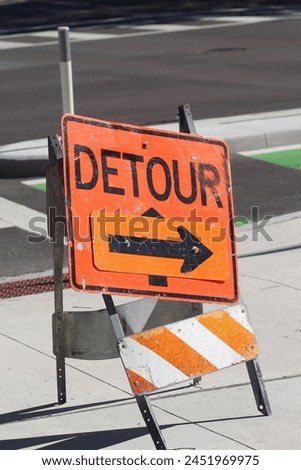 Construction Detour Sign on Roadway - Stock Photo