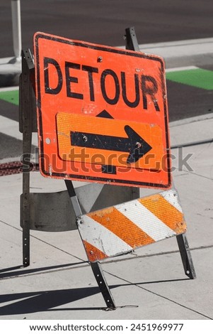 Construction Detour Sign on Roadway - Stock Photo