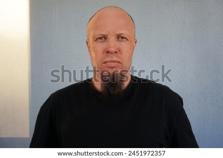Men's beard. The guy's face is large. Brutal macho. Mustache and beard. Barber. Lumberjack. Portrait of a handsome man with a beard                                Royalty-Free Stock Photo #2451972357