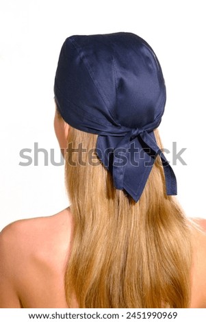 bandana blue on blonde womans head from the back on white background