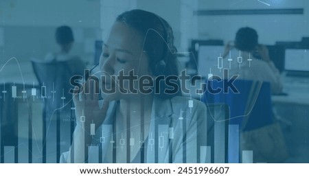 Image of financial data processing over asian businesswoman using phone headset in office. Global business and digital interface concept digitally generated image.