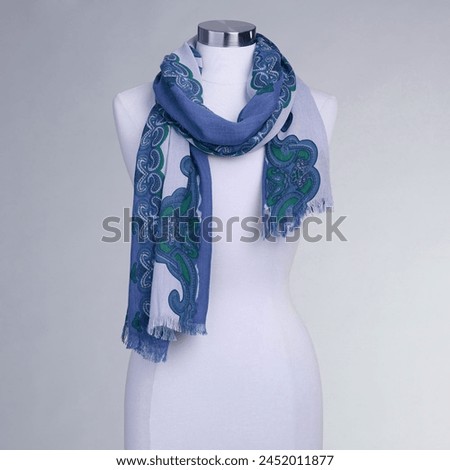 Mannequin fabric bandana ornamental motifs, versatile wrap for shoulders. Can be used as a scarf, blanket, and more. Fabric silk scarf blue printed with fine finishes and large size. Isolated on white