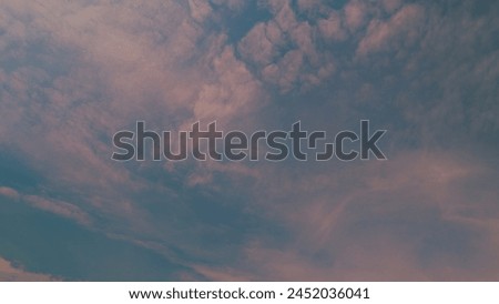 Blue Morning Sky With Pink Clouds. Dramatic Sunrise. Meteorology Heaven. Royalty-Free Stock Photo #2452036041