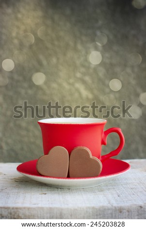 Red cup of coffee with hearts 