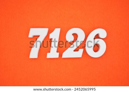 Orange felt is the background. The numbers 7126 are made from white painted wood.