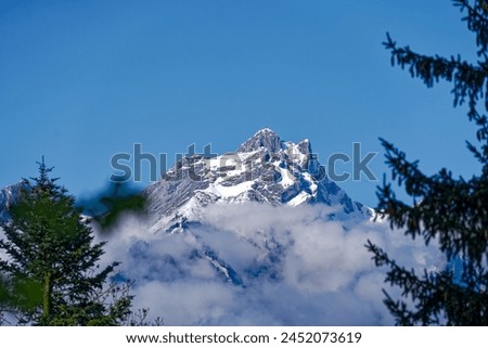 Scenic view of famous snow covered Pilauts mountain seen from Swiss village of Kehrsiten on a sunny spring day. Photo taken April 11th, 2024, Kehrsiten, Canton Nidwalden, Switzerland.