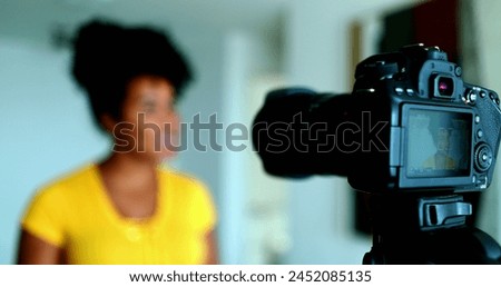 Energetic Young Black Female Vlogger Sharing Insights on Camera for Web Channel, 20s Content Creator Active in Digital Media