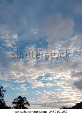 Beautiful sunset, with clouds like cotton candy Royalty-Free Stock Photo #2452101089