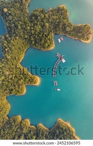 Floating bungalow on the Cheow lan Lake in Khao Sok National Park in Surat Thani, Thailand Royalty-Free Stock Photo #2452106595