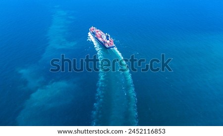 Stern of large cargo ship import export container box shipping for sales, on the ocean sea concept transportation logistics and service to customer and supply change, for back ground