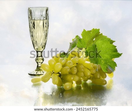 Still life with white wine glass and grapes