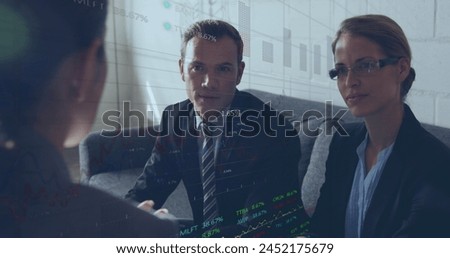 Image of stock market data processing over diverse businesspeople discussing at office. Global finance and business technology concept