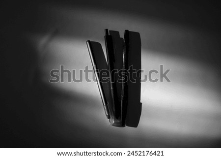 black and white from three pens with sunlight and surrounded by shadows Royalty-Free Stock Photo #2452176421