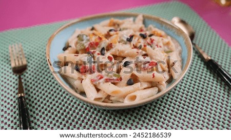 Delicious Pasta Preparation - Served on a pink matt. An international recipe different angle pictures.