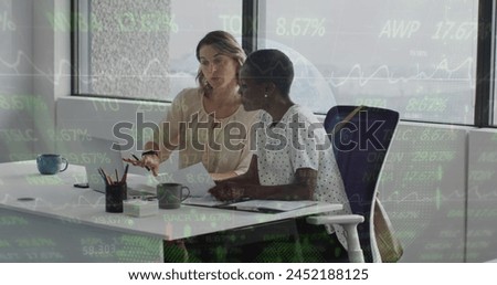 Image of financial data processing over diverse business people at office. Global finances, business and digital interface concept digitally generated image.