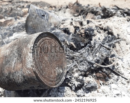 Cans in the fire after burning